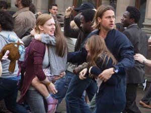 Brad Pitt and Mireille Enos struggle to escape a tepid movie in 'World War Z'.
